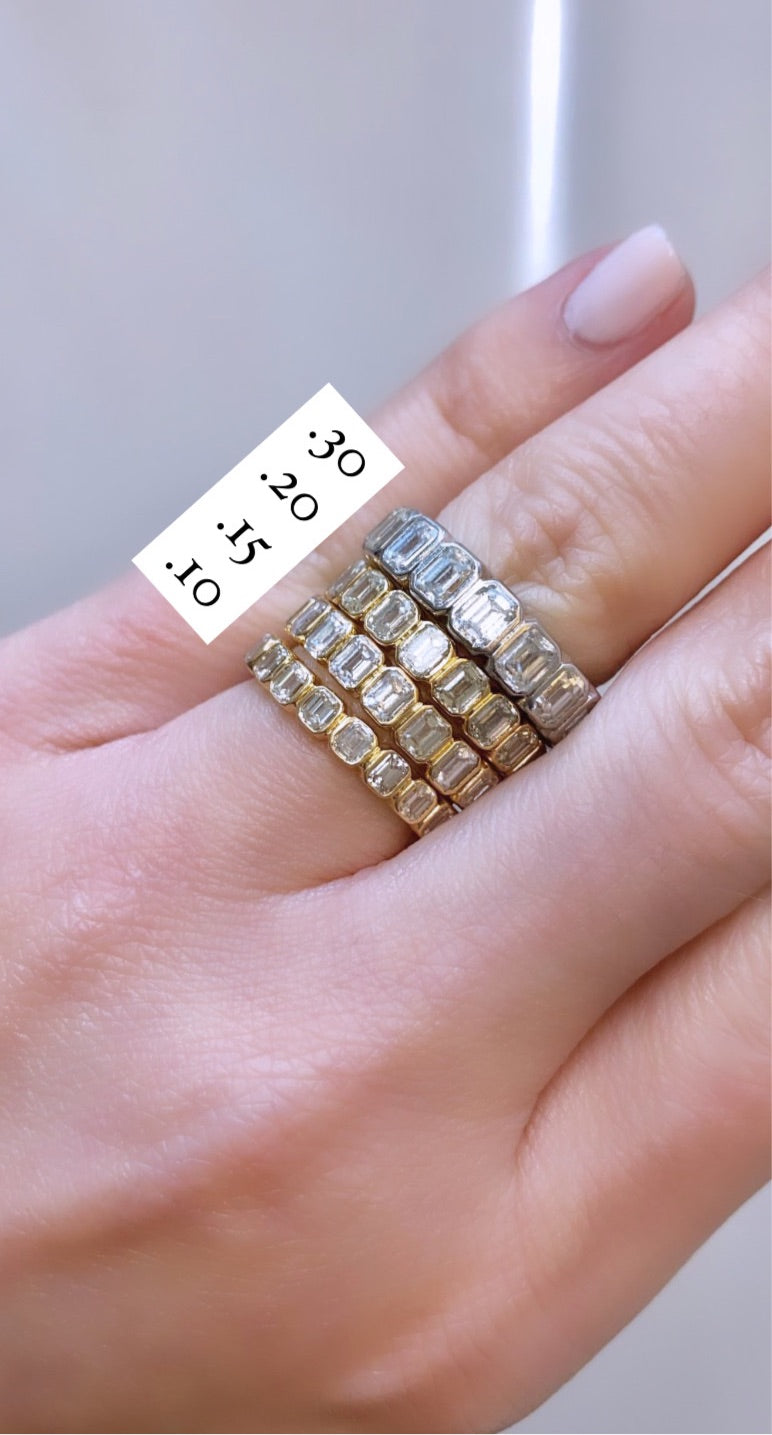 Bezeled Emerald Eternity Band