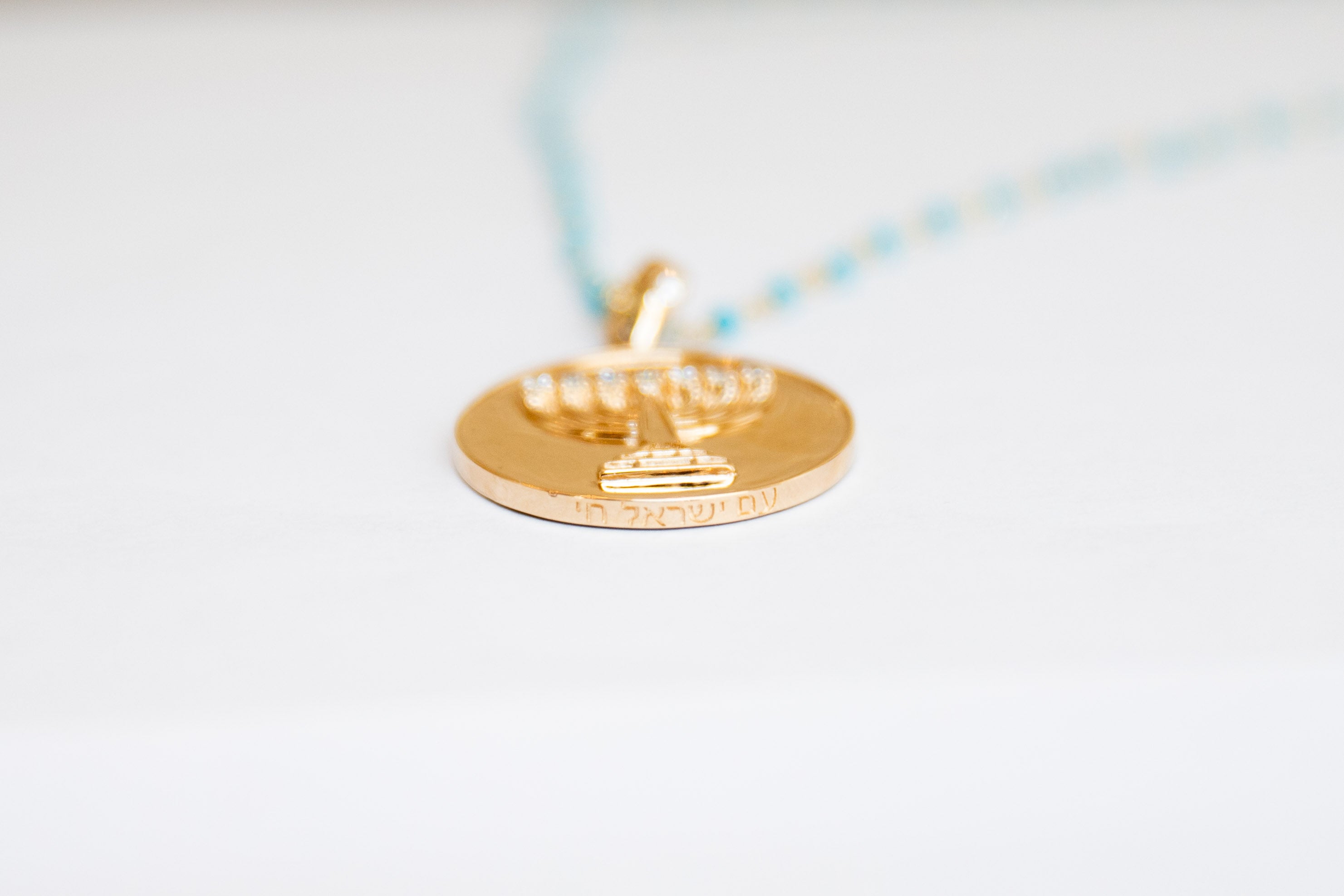 The Mazel Coin on Turquoise Chain